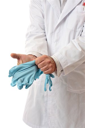 Doctor, surgeon or scientist putting on gloves personal protective equipment. Stock Photo - Budget Royalty-Free & Subscription, Code: 400-07039627