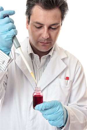 simsearch:400-04962353,k - Amale  scientist using a pipette for accuracy. Stock Photo - Budget Royalty-Free & Subscription, Code: 400-07039628