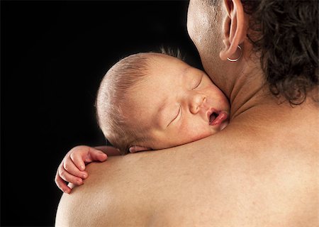 Newborn boy sleeping on his dad's shoulder over black Stock Photo - Budget Royalty-Free & Subscription, Code: 400-07033769