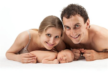 Young caucasian couple with one week old boy over white Stock Photo - Budget Royalty-Free & Subscription, Code: 400-07033772