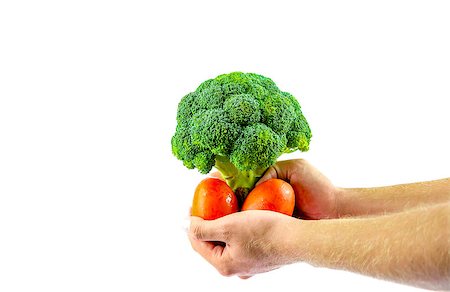 Farmer holding fresh tomatoes and a broccoli flower Stock Photo - Budget Royalty-Free & Subscription, Code: 400-07044569
