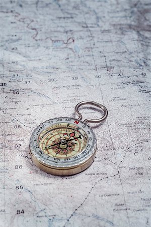 simsearch:400-04908052,k - Old compass on a cartographic map of mountains Stockbilder - Microstock & Abonnement, Bildnummer: 400-07044574