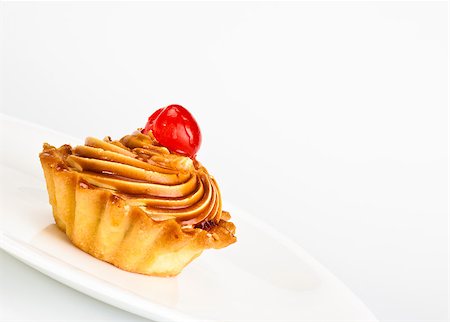 fruit paste - cake with cherry on dish grey background Photographie de stock - Aubaine LD & Abonnement, Code: 400-07045154