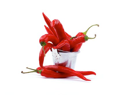 Arrangement of Perfect Red Hot Chili Peppers in Tin Bucket isolated on white background Stock Photo - Budget Royalty-Free & Subscription, Code: 400-07045604