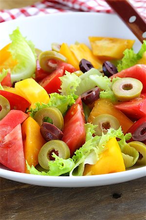 simsearch:400-07625437,k - salad of colorful tomatoes and olives on the wooden table Stock Photo - Budget Royalty-Free & Subscription, Code: 400-07046125