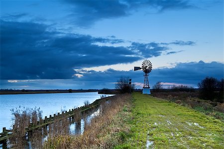 simsearch:400-07046539,k - turbine windmill by lake over morning cloudscape, Groningen Stock Photo - Budget Royalty-Free & Subscription, Code: 400-07046541