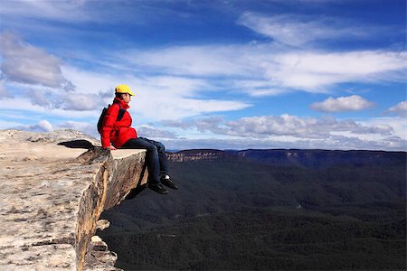 simsearch:400-08919033,k - Sitting on Top of the World - hiker rests and admires views of Blue Mountains on a beautiful sunny day.  Selective focus. Stock Photo - Budget Royalty-Free & Subscription, Code: 400-07046930