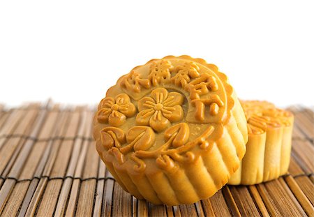 simsearch:400-05754691,k - Traditional brown mooncakes. Chinese mid autumn festival foods. The Chinese words on the mooncakes means assorted fruits nuts, not a logo or trademark. Foto de stock - Super Valor sin royalties y Suscripción, Código: 400-07047175