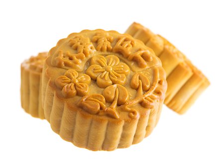 simsearch:400-04998692,k - Traditional brown mooncakes isolated on white background. Chinese mid autumn festival foods. The Chinese words on the mooncakes means assorted fruits nuts, not a logo or trademark. Foto de stock - Super Valor sin royalties y Suscripción, Código: 400-07047173