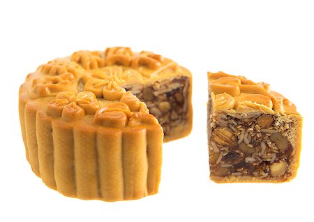 simsearch:400-07047172,k - Traditional mooncake cutted isolated on white background. Chinese mid autumn festival foods. The Chinese words on the mooncake means assorted fruits nuts, not a logo or trademark. Stockbilder - Microstock & Abonnement, Bildnummer: 400-07047191