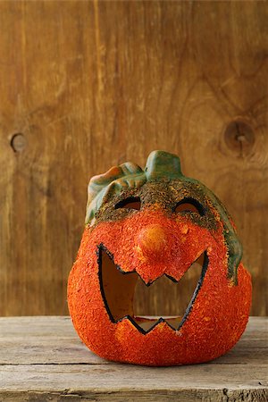 simsearch:400-08319221,k - Halloween pumpkin Jack O'Lantern on a wooden background Photographie de stock - Aubaine LD & Abonnement, Code: 400-07048385