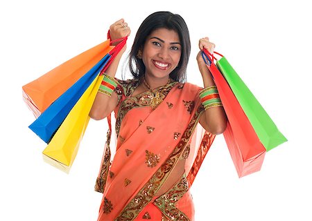 simsearch:400-08223620,k - Portrait of beautiful traditional Indian woman in sari dress holding shopping bags, isolated over white background. Stock Photo - Budget Royalty-Free & Subscription, Code: 400-07048899