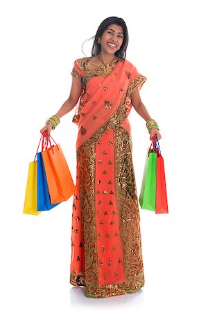 simsearch:400-08223620,k - Portrait of full length beautiful traditional Indian woman in sari dress holding shopping bags, isolated over white background. Stock Photo - Budget Royalty-Free & Subscription, Code: 400-07048931