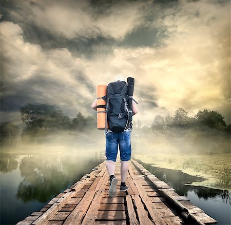 Tourist on the wooden bridge of the morning river Stock Photo - Budget Royalty-Free & Subscription, Code: 400-07049123