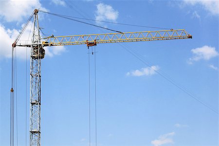simsearch:400-04422019,k - A large construction crane against the blue sky Fotografie stock - Microstock e Abbonamento, Codice: 400-07049387