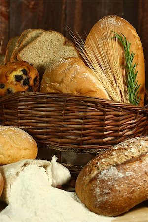 Fresh Baked Bread on Wooden Background Stock Photo - Budget Royalty-Free & Subscription, Code: 400-07049555