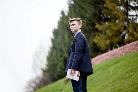 Young handsome man in suit with book walking the park Stock Photo - Budget Royalty-Free & Subscription, Code: 400-07040914