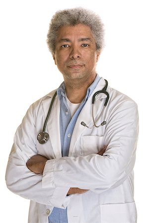 simsearch:400-07042108,k - Serious doctor with folded arms on white background Stock Photo - Budget Royalty-Free & Subscription, Code: 400-07042096