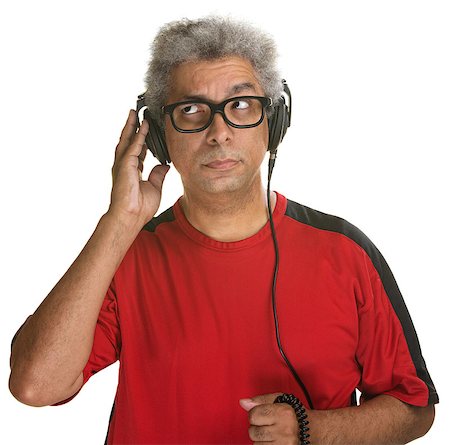 simsearch:400-07042113,k - Handsome mature man listening with headphones on white background Stock Photo - Budget Royalty-Free & Subscription, Code: 400-07042107