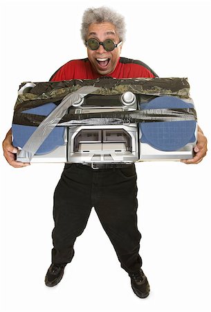 simsearch:400-07042113,k - Giddy middle aged man carrying taped boom box Stock Photo - Budget Royalty-Free & Subscription, Code: 400-07042116