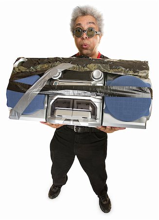 simsearch:400-07042113,k - Man having difficulty carrying large 1980s portable radio Stock Photo - Budget Royalty-Free & Subscription, Code: 400-07042121