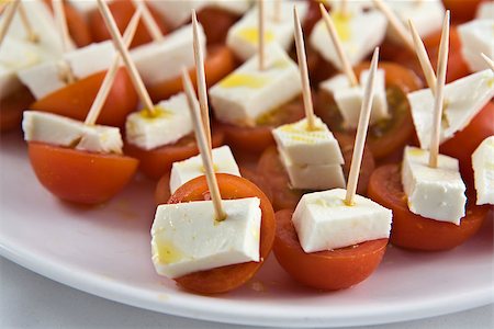 Cherry tomato brochettes with cottage cheese and drops of olive oil Stock Photo - Budget Royalty-Free & Subscription, Code: 400-07042244