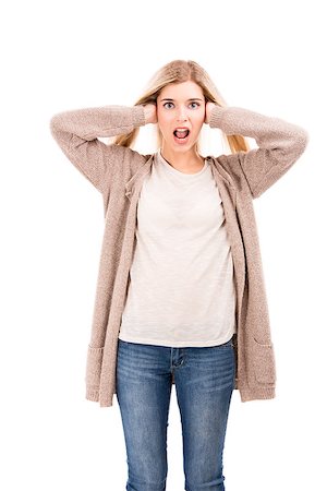 portrait screaming girl - Beautiful blonde woman looking to the camera with hands on the ears, isolated over white background Stock Photo - Budget Royalty-Free & Subscription, Code: 400-07042589