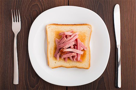 simsearch:400-07036577,k - Toast with ham on a white plate Stock Photo - Budget Royalty-Free & Subscription, Code: 400-07042641