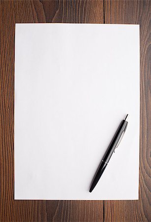 Blank sheet of white paper and pen on a table Stock Photo - Budget Royalty-Free & Subscription, Code: 400-07042651