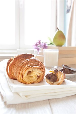 Croissants on table with chocolate, milk and coffee, continental breakfast Stock Photo - Budget Royalty-Free & Subscription, Code: 400-07043535