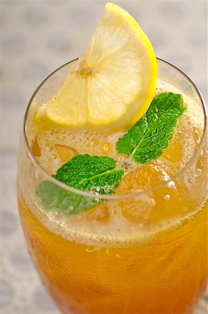 refreshing Ice tea closeup macro with lemon and mint leaves Stock Photo - Budget Royalty-Free & Subscription, Code: 400-07043796