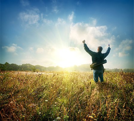 Man in the field at sunrise in autumn Stockbilder - Microstock & Abonnement, Bildnummer: 400-07054328