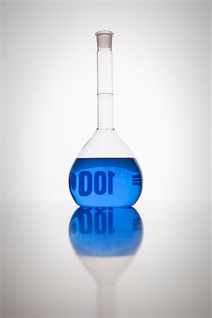 A glass bottle with blue liquid in a laboratory Stock Photo - Budget Royalty-Free & Subscription, Code: 400-07054395