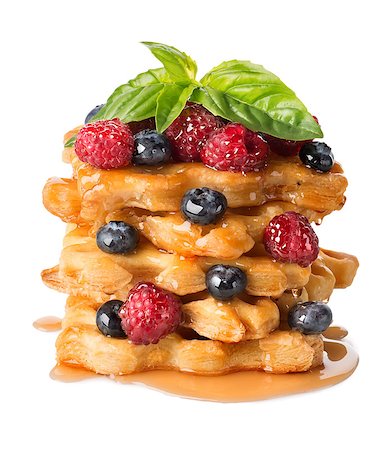 strudel - Pyramid of puff pastry with berries isolated on white Fotografie stock - Microstock e Abbonamento, Codice: 400-07054919