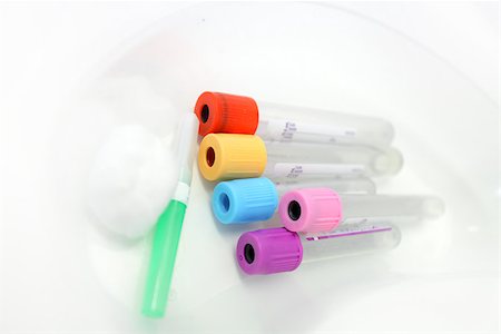 Unlabelled pathology phlebotomy, blood collecting vacutainer tubes a 21 gauge needle and cotton wool lying in a kidney dish for a blood collection procedure Stock Photo - Budget Royalty-Free & Subscription, Code: 400-07055716