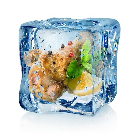 simsearch:400-05357996,k - Fried chicken thighs in ice cube isolated on a white background Photographie de stock - Aubaine LD & Abonnement, Code: 400-07056074