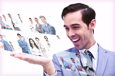 simsearch:695-05771557,k - Pleased man admiring pictures on digital screen on white background Stock Photo - Budget Royalty-Free & Subscription, Code: 400-07057001