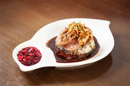 simsearch:825-02304591,k - Delicious duck breast dish with rice and chutney served in classy restaurant Stock Photo - Budget Royalty-Free & Subscription, Code: 400-07057155
