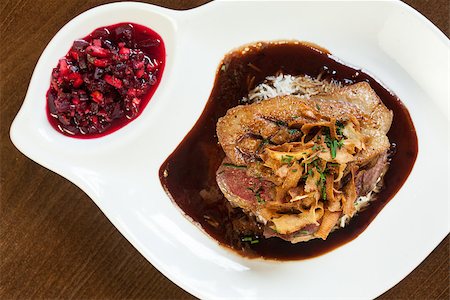simsearch:825-02304591,k - Delicious duck breast dish with gravy and rice served in classy restaurant Stock Photo - Budget Royalty-Free & Subscription, Code: 400-07057158