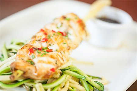 simsearch:400-07057171,k - Asian fish dish with noodles and julienne vegetables and sauce served in classy restaurant Foto de stock - Super Valor sin royalties y Suscripción, Código: 400-07057164