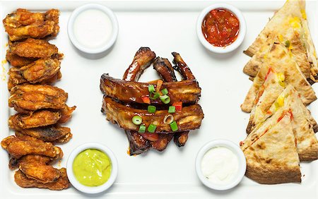 food platter presentation - Overhead of an appetizing platter of finger food served in classy restaurant Stock Photo - Budget Royalty-Free & Subscription, Code: 400-07057168