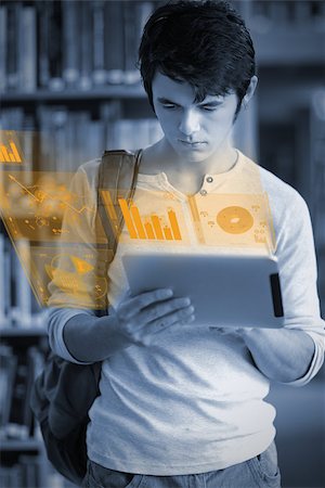 simsearch:400-07138128,k - Concentrated handsome student working on his futuristic tablet in university library Stock Photo - Budget Royalty-Free & Subscription, Code: 400-07057824