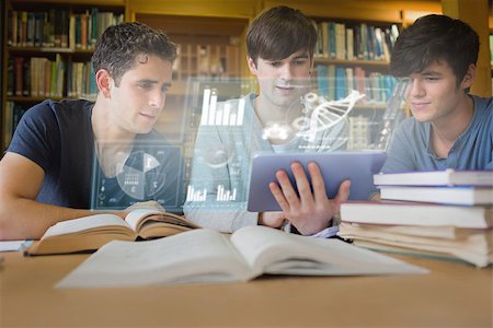 simsearch:400-07057823,k - Concentrated young men studying medicine together with futuristic interface in university library Foto de stock - Super Valor sin royalties y Suscripción, Código: 400-07057852