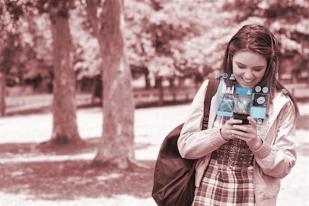 Cheerful young woman texting on her futuristic smartphone in bright park Stock Photo - Budget Royalty-Free & Subscription, Code: 400-07057867