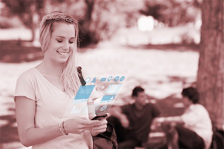 simsearch:400-07138128,k - Cheerful pretty blonde working on her digital smartphone in bright park Stock Photo - Budget Royalty-Free & Subscription, Code: 400-07057874