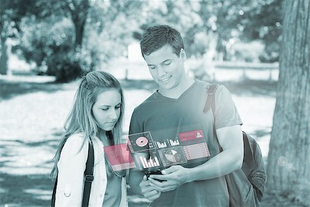 simsearch:400-07138128,k - Cheerful college friends using digital phone in bright park Stock Photo - Budget Royalty-Free & Subscription, Code: 400-07057885