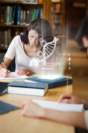 Smiling college student working on her digital tablet with futuristic interface in university library Stock Photo - Budget Royalty-Free & Subscription, Code: 400-07057921