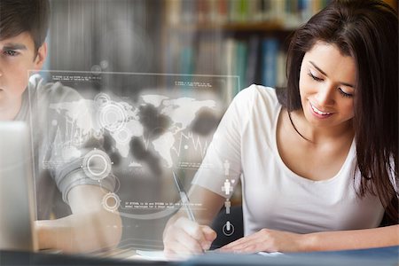 simsearch:400-07138128,k - Cheerful college student analysing map on digital interface in university library Stock Photo - Budget Royalty-Free & Subscription, Code: 400-07057923