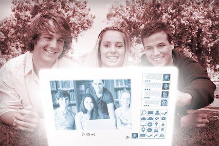 simsearch:400-07138128,k - Cheerful college friends watching photos together on digital interface in bright park Stock Photo - Budget Royalty-Free & Subscription, Code: 400-07057932