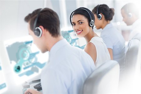 simsearch:400-07138128,k - Pretty call center worker using futuristic interface hologram smiling at camera in office Stock Photo - Budget Royalty-Free & Subscription, Code: 400-07057957